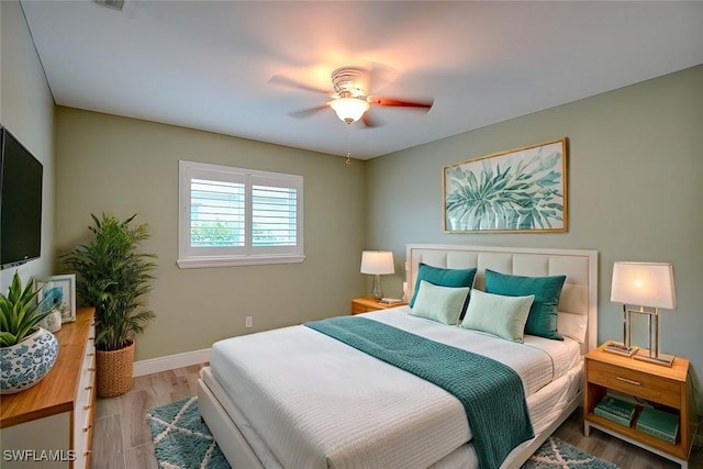 bedroom featuring ceiling fan and hardwood / wood-style floors