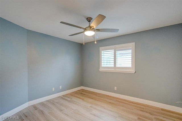 spare room with light hardwood / wood-style flooring and ceiling fan