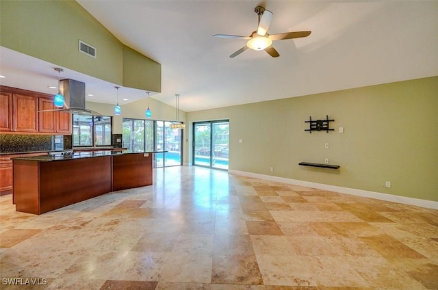 kitchen featuring pendant lighting, tasteful backsplash, high vaulted ceiling, island range hood, and ceiling fan