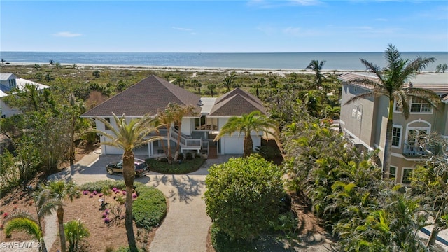 aerial view with a view of the beach and a water view