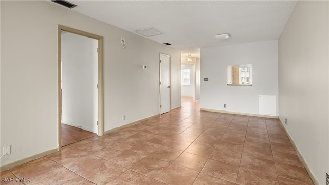 view of tiled spare room