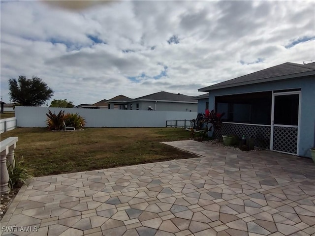 view of patio / terrace with a sunroom