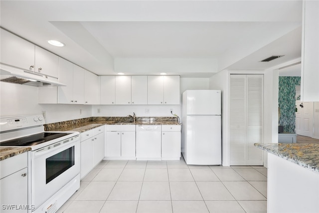 kitchen featuring white cabinets, white appliances, stone counters, and sink