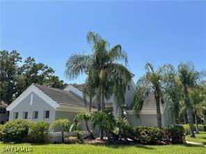 view of side of property with a lawn