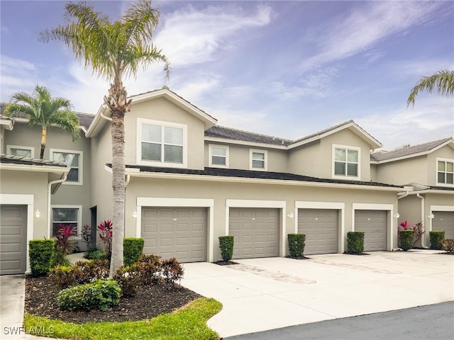 townhome / multi-family property featuring a garage