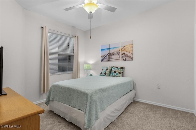 bedroom featuring light carpet and ceiling fan