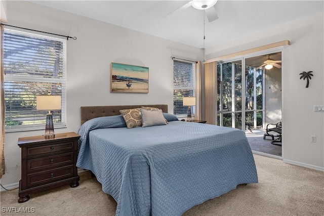 bedroom featuring access to outside, light colored carpet, and ceiling fan