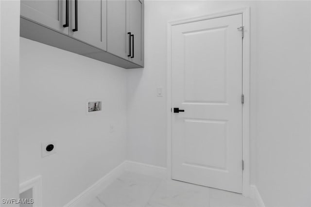 laundry room featuring washer hookup, hookup for an electric dryer, and cabinets