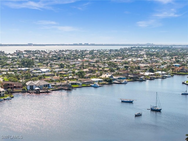 birds eye view of property with a residential view and a water view