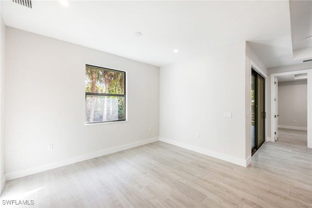 empty room with light wood-type flooring