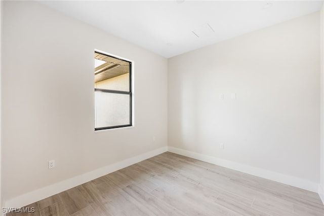 unfurnished room with light hardwood / wood-style flooring