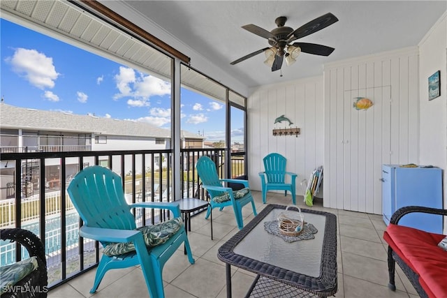 sunroom / solarium with ceiling fan