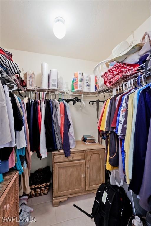 spacious closet featuring light tile patterned flooring