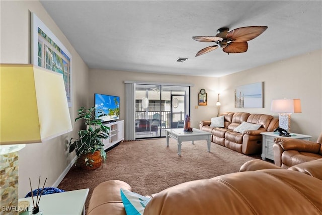 carpeted living room featuring ceiling fan