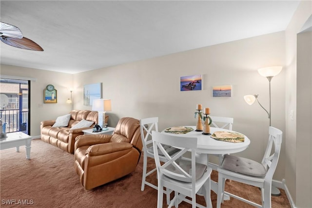 carpeted living room featuring ceiling fan