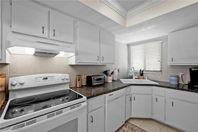 kitchen featuring white appliances and white cabinetry