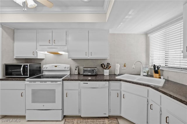 kitchen featuring sink, white cabinets, white appliances, and ornamental molding