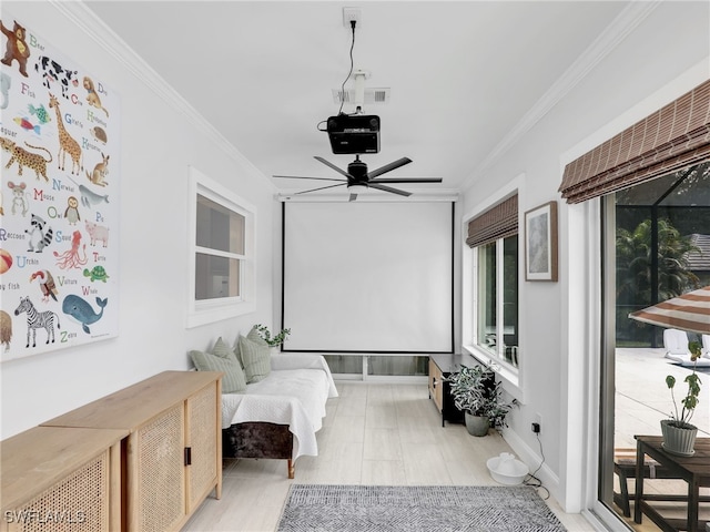 interior space with crown molding, baseboards, and ceiling fan