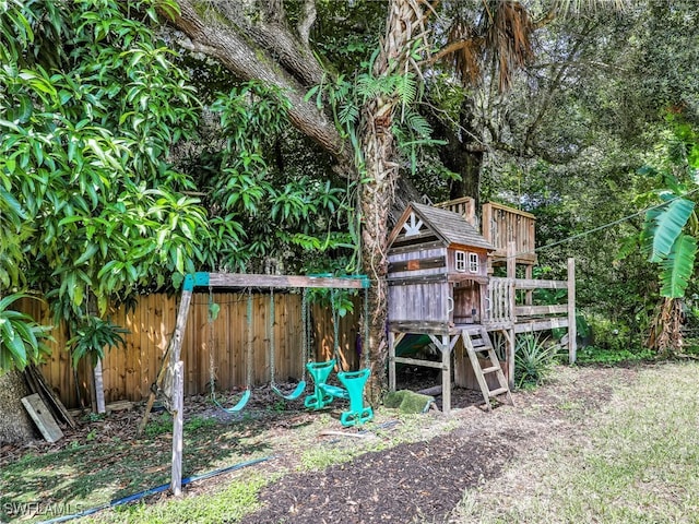 view of jungle gym with fence