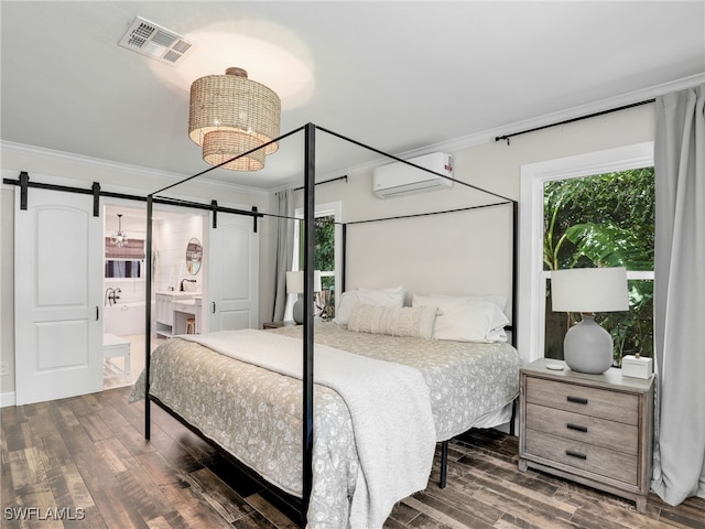 bedroom with a barn door, dark wood-type flooring, visible vents, ornamental molding, and a wall mounted air conditioner