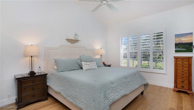 bedroom featuring multiple windows, ceiling fan, and light wood-type flooring