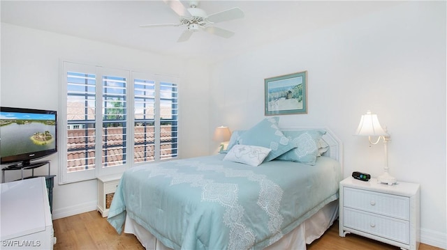 bedroom with ceiling fan and light wood-type flooring