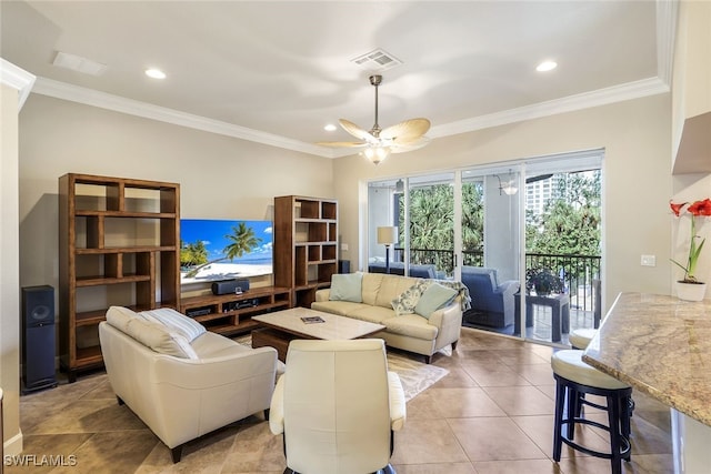 living room with light tile patterned floors, ceiling fan, and crown molding