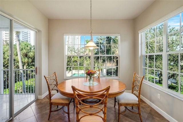 tiled dining room with plenty of natural light