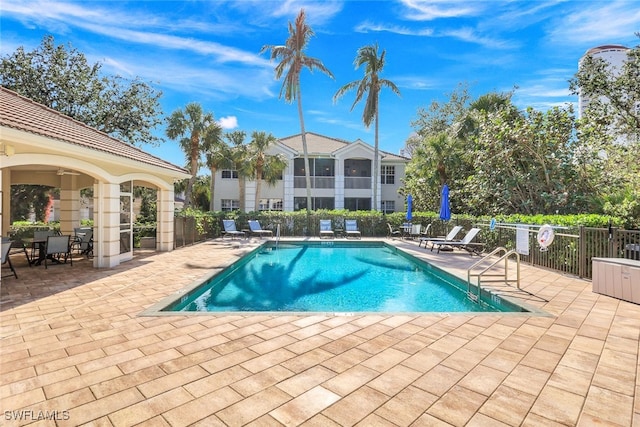 view of swimming pool with a patio