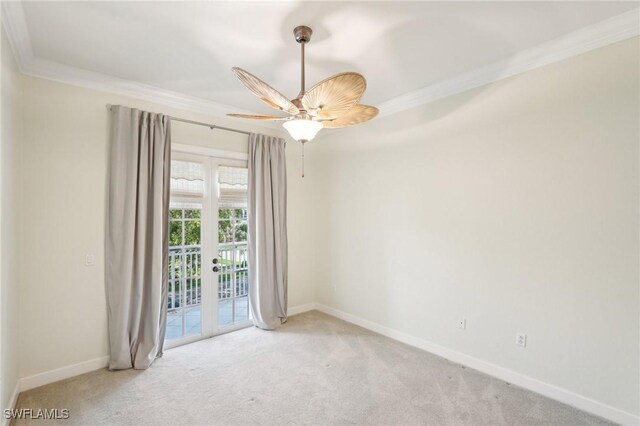 25970 Nesting Ct Unit 201, Bonita Springs, FL 34134 - empty room featuring crown molding, light carpet, baseboards, french doors, and ceiling fan