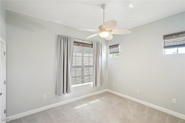 25970 Nesting Ct Unit 201, Bonita Springs, FL 34134 - spare room with a ceiling fan, baseboards, and carpet floors