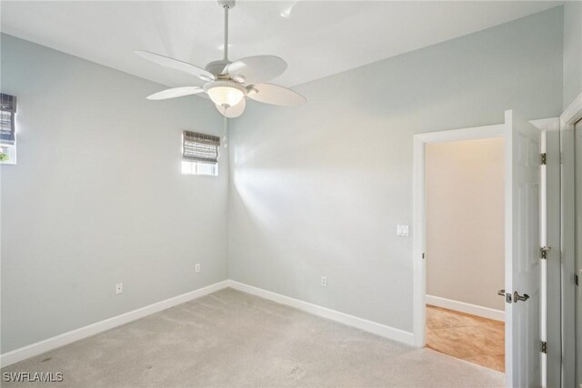 25970 Nesting Ct Unit 201, Bonita Springs, FL 34134 - spare room with a ceiling fan, light carpet, and baseboards