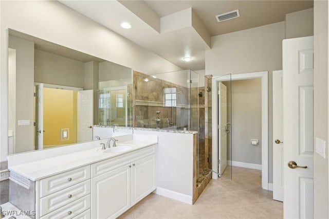 25970 Nesting Ct Unit 201, Bonita Springs, FL 34134 - full bath with a shower stall, vanity, tile patterned flooring, and baseboards