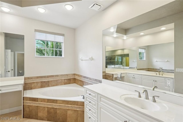 25970 Nesting Ct Unit 201, Bonita Springs, FL 34134 - bathroom with plenty of natural light, a bath, recessed lighting, vanity, and tile patterned flooring