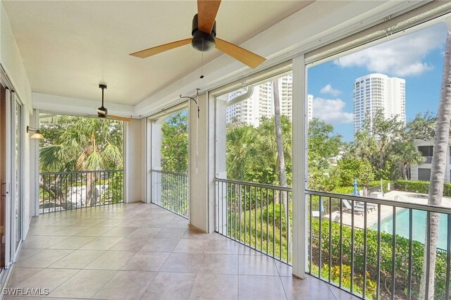 25970 Nesting Ct Unit 201, Bonita Springs, FL 34134 - unfurnished sunroom featuring tile patterned floors