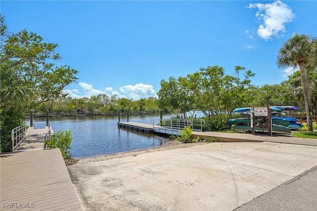 25970 Nesting Ct Unit 201, Bonita Springs, FL 34134 - dock area with a boat ramp and a water view