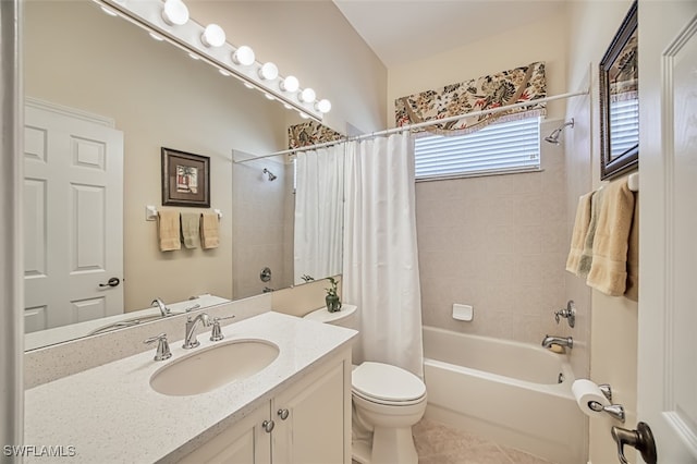 full bathroom featuring tile patterned floors, shower / bath combo with shower curtain, vanity, and toilet