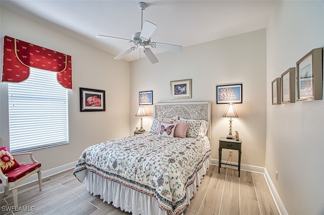 bedroom with ceiling fan and light hardwood / wood-style floors