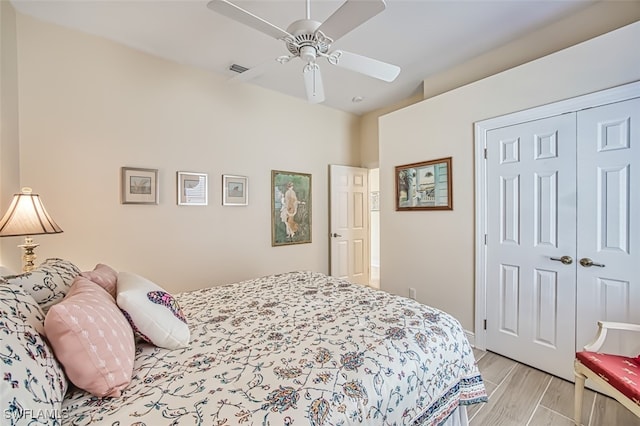 bedroom featuring ceiling fan and a closet