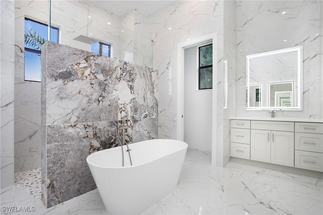 bathroom featuring vanity and separate shower and tub