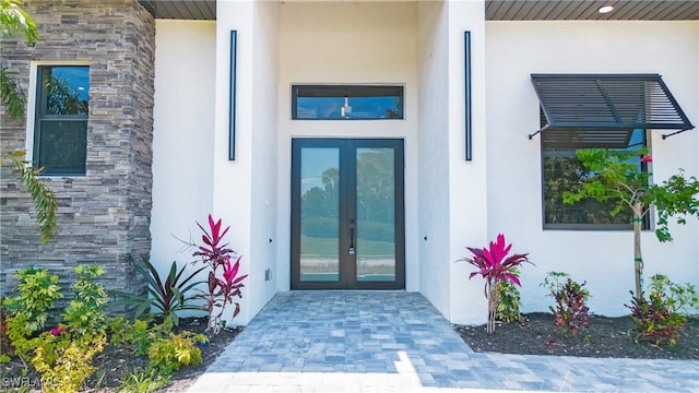 doorway to property featuring french doors