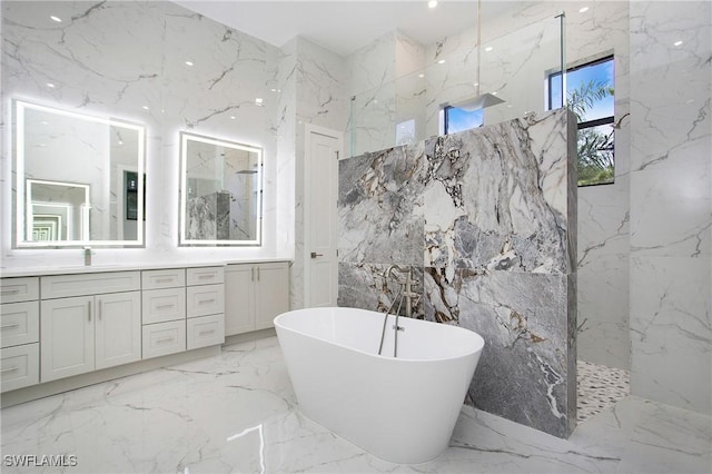 bathroom with vanity, separate shower and tub, and tile walls