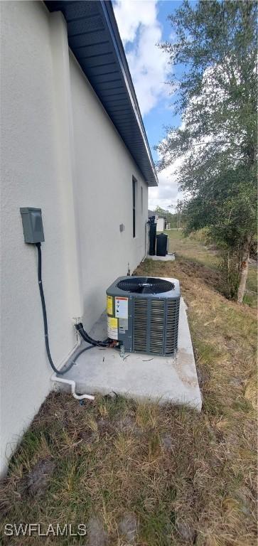 view of side of property with central AC unit