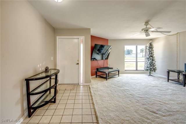 interior space featuring ceiling fan and light tile patterned flooring