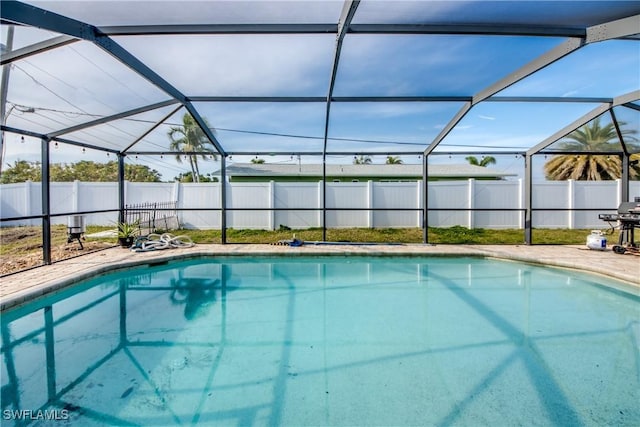 view of pool featuring a grill and a lanai