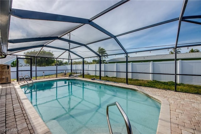 view of pool featuring a patio and a lanai