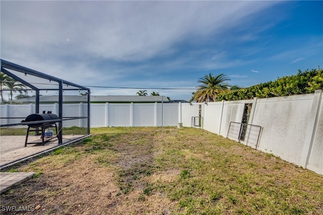 view of yard featuring a lanai and a patio