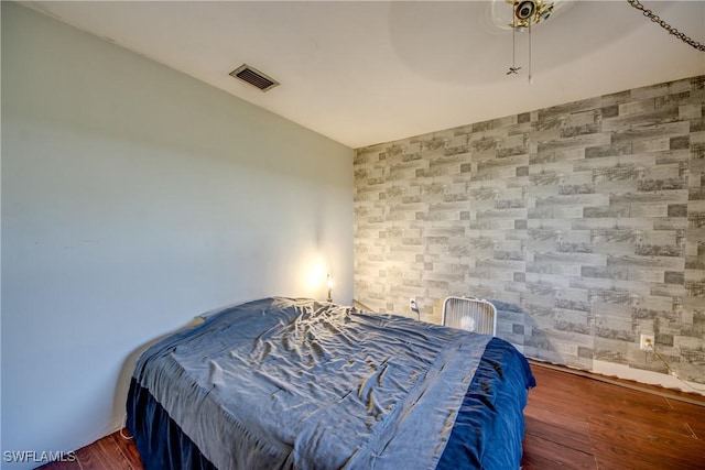 bedroom featuring ceiling fan and dark hardwood / wood-style floors