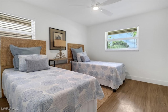 bedroom featuring ceiling fan and wood-type flooring