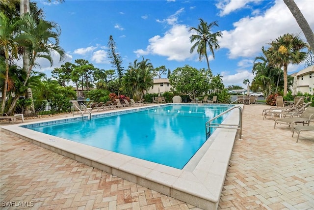 view of swimming pool with a patio